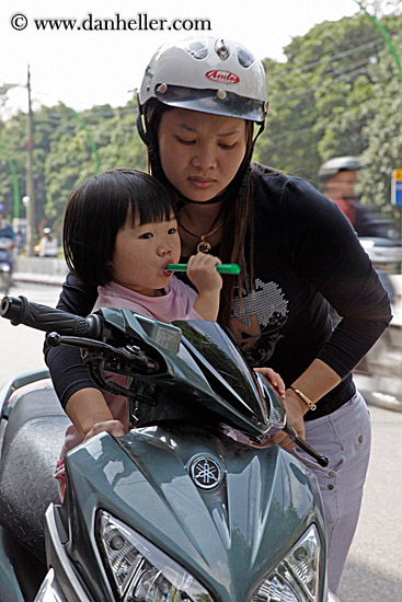 toddler-girl-on-motorcycle-w-mother.jpg