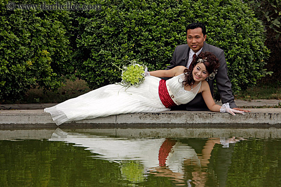 reclining-bride-n-broom-w-flowers-by-water-1.jpg