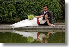 images/Asia/Vietnam/Hanoi/People/Couples/reclining-bride-n-broom-w-flowers-by-water-1.jpg