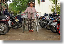 images/Asia/Vietnam/HoiAn/Bikes/old-woman-walking-bikes.jpg