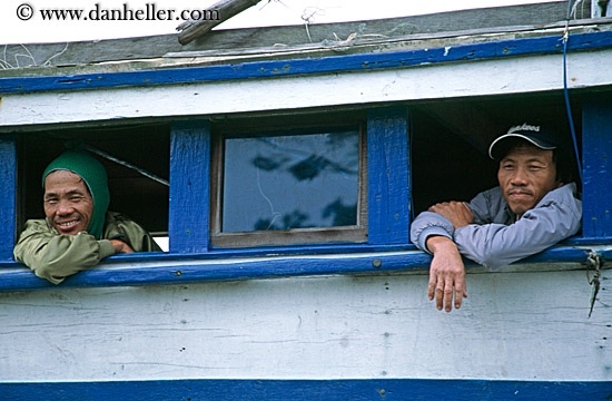 men-looking-out-boat-windows.jpg