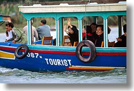 images/Asia/Vietnam/HoiAn/Boats/women-waving-from-tourist-boat.jpg