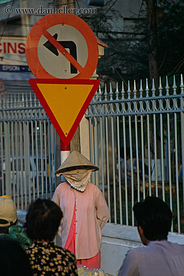 woman-w-scarf-under-triangle-sign.jpg