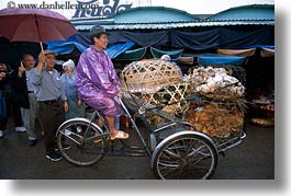 images/Asia/Vietnam/Hue/People/Men/man-riding-rickshaw-bike.jpg