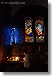 asia, asian, candles, catholic, glow, lights, materials, men, neon, people, saigon, stained glass, vertical, vietnam, photograph