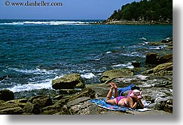 images/Australia/Sydney/ManlyBeach/woman-reading-on-rocks.jpg
