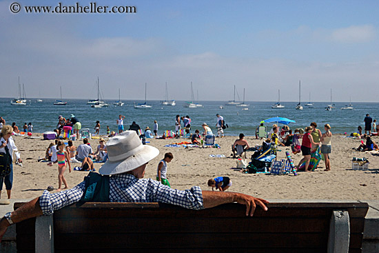 man-in-hat-looking-at-crowded-beach.jpg