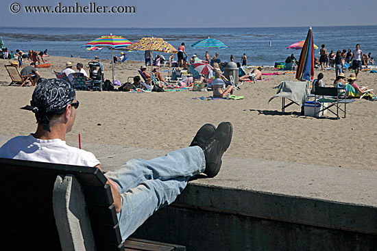 guy-in-bandana-looking-at-crowded-beach.jpg