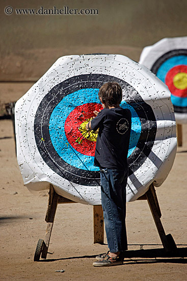 boy-pulling-arrows-from-target-1.jpg