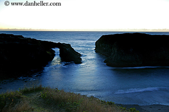 dusk-ocean-rocky-bridge.jpg