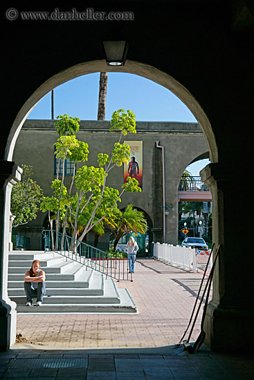 woman-sitting-on-stairs-under-archway.jpg