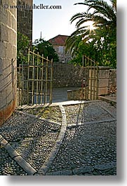 images/Europe/Croatia/Milna/Misc/cobblestone-sidewalk-n-gate.jpg