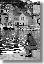 images/Europe/Croatia/Milna/People/man-sitting-at-water.jpg