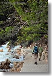 images/Europe/Croatia/Rab/Hiking/couple-walking-by-trees-n-water-2.jpg