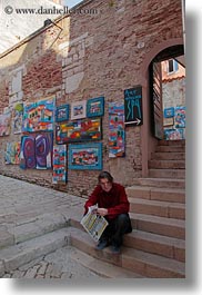 images/Europe/Croatia/Rovinj/People/man-sitting-by-paintings.jpg
