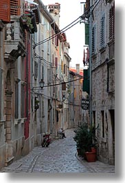 images/Europe/Croatia/Rovinj/Streets/man-sitting-by-motorcycle-on-narrow-street-1.jpg