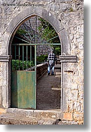 arches, croatia, doors, europe, gates, green, irons, men, sipan, vertical, photograph