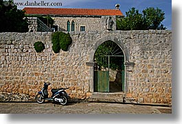 images/Europe/Croatia/Sipan/DoorsWindows/arch-door-n-motorcycle.jpg