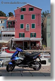 images/Europe/Croatia/VeliLosinj/blue-motorcycle-n-red-bldg.jpg