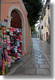 images/Europe/Croatia/VeliLosinj/rack-of-hats-n-cobblestone-street.jpg