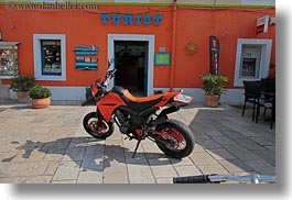 images/Europe/Croatia/VeliLosinj/tourist-sign-n-orange-motorcycle-1.jpg