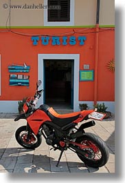 images/Europe/Croatia/VeliLosinj/tourist-sign-n-orange-motorcycle-2.jpg