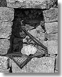 images/Europe/France/Provence/Misc/rock-on-grate-in-stones-bw.jpg