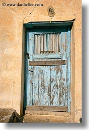 images/Europe/Greece/Amorgos/DoorsWins/old-light-blue-door-w-yellow-wall-1.jpg