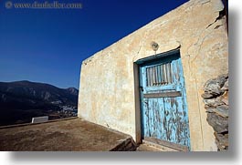 images/Europe/Greece/Amorgos/DoorsWins/old-light-blue-door-w-yellow-wall-2.jpg
