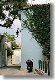 images/Europe/Greece/Athens/Streets/motorcycle-n-ivy-covered-bldgs.jpg