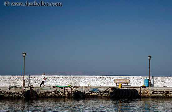 man-walking-on-stone-pier.jpg