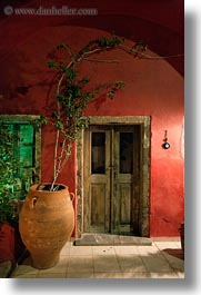 images/Europe/Greece/Santorini/Misc/wood-door-red-wall-n-potted-tree-2.jpg