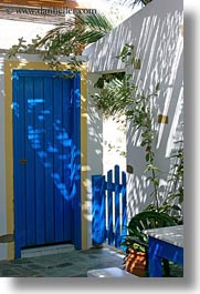 images/Europe/Greece/Tinos/DoorsWindows/shadowy-blue-door-n-plants.jpg