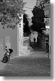 black and white, europe, greece, men, motorcycles, silhouettes, streets, tinos, towns, vertical, photograph