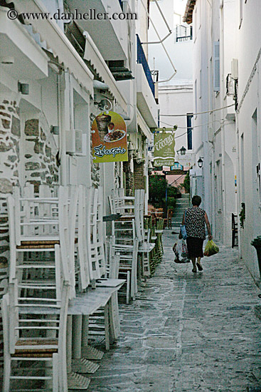 woman-walking-by-stacked-chairs.jpg