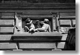 images/Europe/Hungary/Budapest/Art/cherub-blowing-horn-stone-relief-bw.jpg