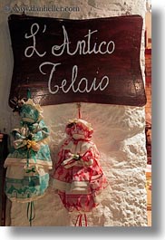 images/Europe/Italy/Puglia/Alberobello/Misc/dolls-on-wall.jpg