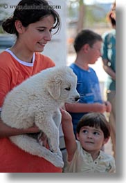 images/Europe/Italy/Puglia/Alberobello/People/child-petting-white-puppy.jpg