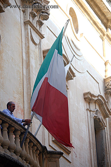 man-raising-italian-flag.jpg