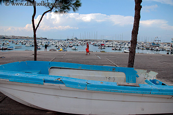 blue-boat-n-man-walking.jpg