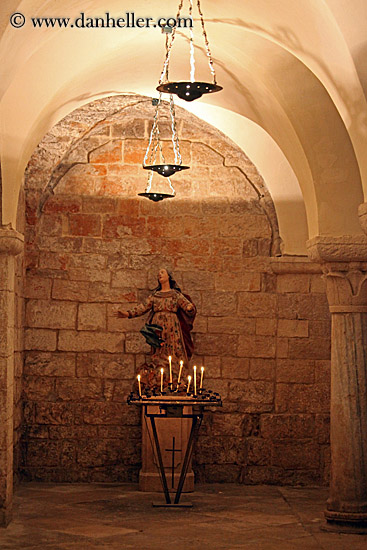 madonna-statue-n-candles-under-arch.jpg