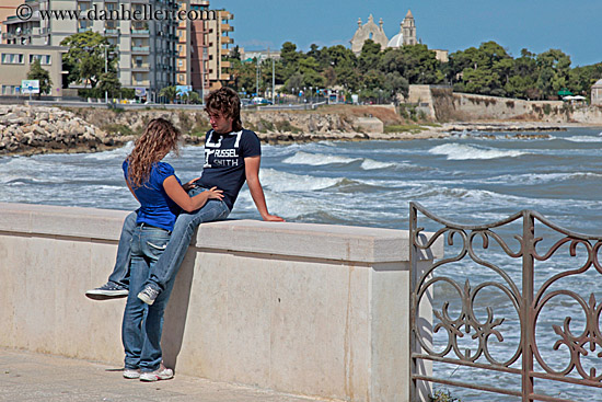 teenage-couple-on-seaside-wall-1.jpg