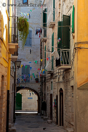 narrow-street-w-colorful-flags-1.jpg