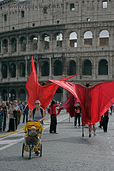 jnj-at-colosseum-w-red-stilt-people.jpg