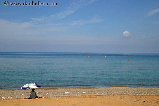 woman-under-beach-umbrella.jpg