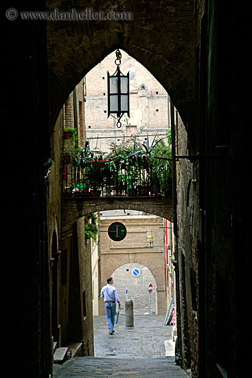 man-walking-through-archway.jpg