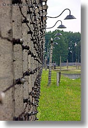 images/Europe/Poland/Auschwitz/barbed-wire-n-lights-n-grass.jpg
