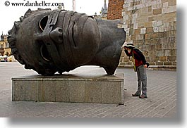 images/Europe/Poland/Krakow/Art/lori-looking-in-statue-head.jpg