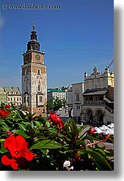 buildings, clock tower, europe, flowers, krakow, poland, structures, towers, vertical, photograph