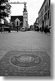 images/Europe/Poland/Krakow/Misc/krakow-manhole-cover-n-church-bw-2.jpg